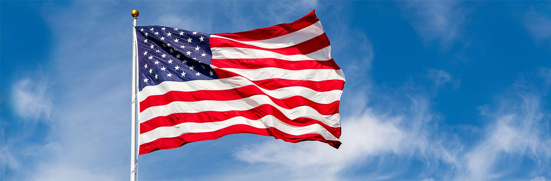 waving american flag blue sky